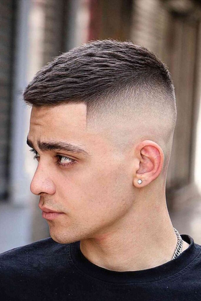 The High and Tight Haircut: 23 Best Styles & Guide for 2026 Burst fade high and tight haircut with curved fade around the ears