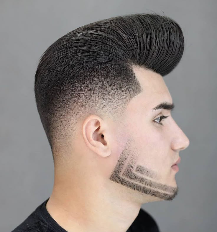 Professional side view of a black man with a clean skin fade haircut and sharp hairline.