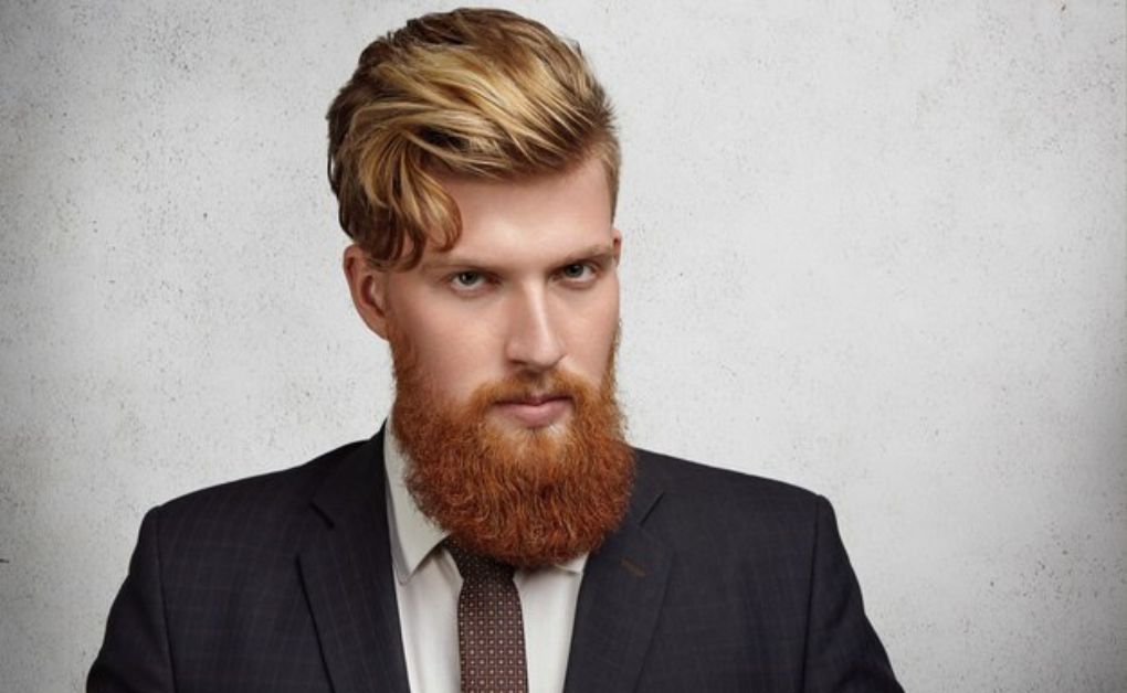 "Low Fade Haircut: 33 Stylish Looks & Expert Grooming Tips" Textured spiky hair with clean low fade