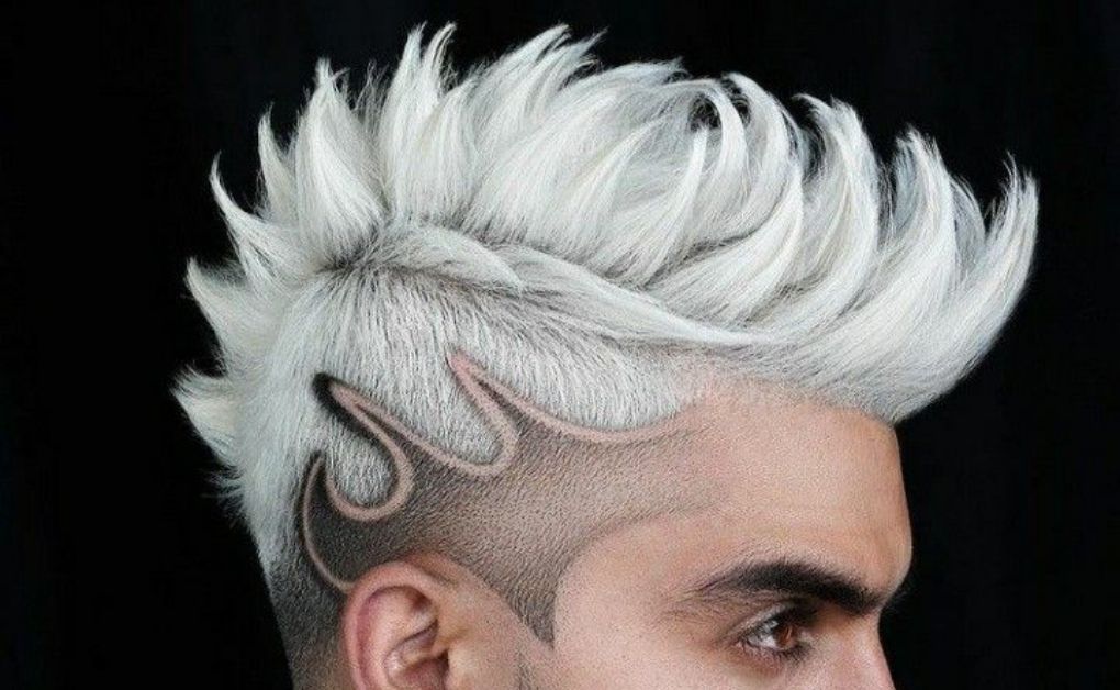 "A classic yet modern High-Contrast Side Shave featuring a high-volume pompadour on top, paired with a sharp fade for a bold and stylish silhouette."