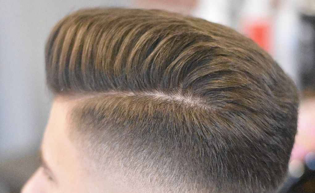 Skin Fade Haircut: 35 Iconic Styles & Grooming Tips for Men High Skin Fade with spiked-up top