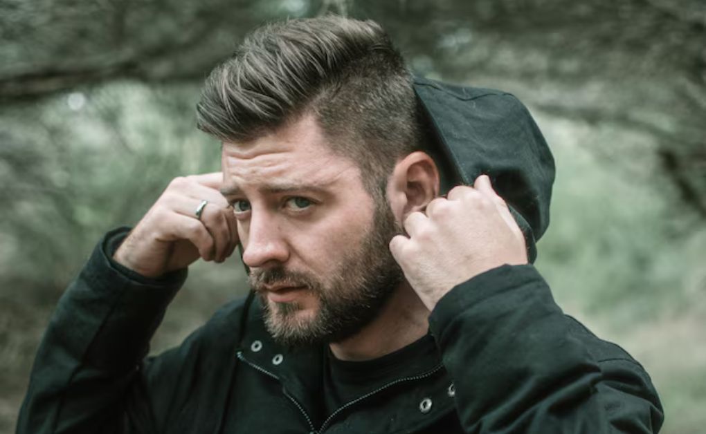 "Low Fade Haircut: 33 Stylish Looks & Expert Grooming Tips" Low drop fade hairstyle curving behind the ear