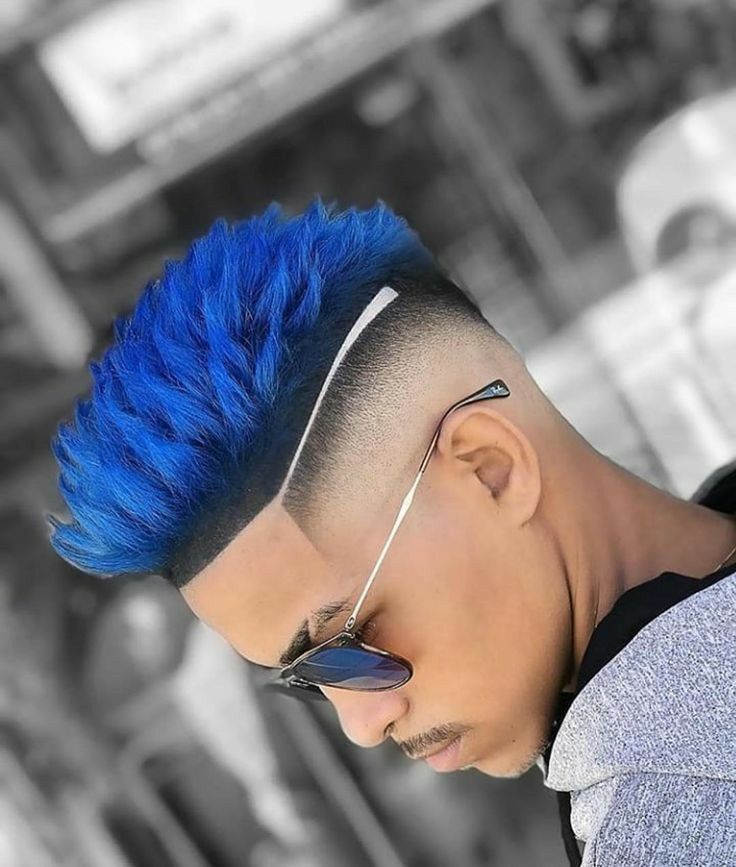 "A modern take on a classic look, this undercut hairstyle fade features short hair swept forward into a Caesar-style fringe, paired with a sharp, high-contrast fade on the sides."