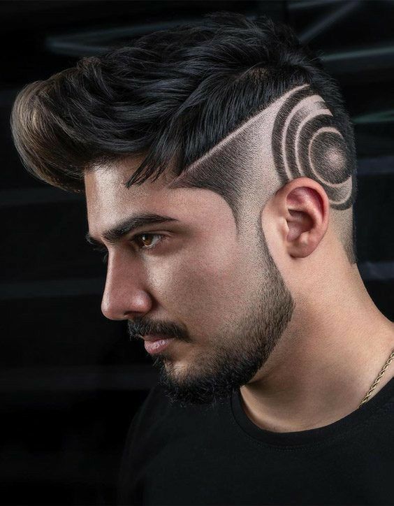 "A bold and edgy undercut hairstyle fade featuring a short textured crop dyed in a vibrant bleached blonde, contrasted with naturally dark, precision-faded sides."