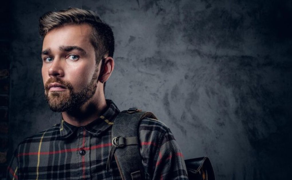 Bold high fade haircut for men starting near the crown for a high-contrast look.