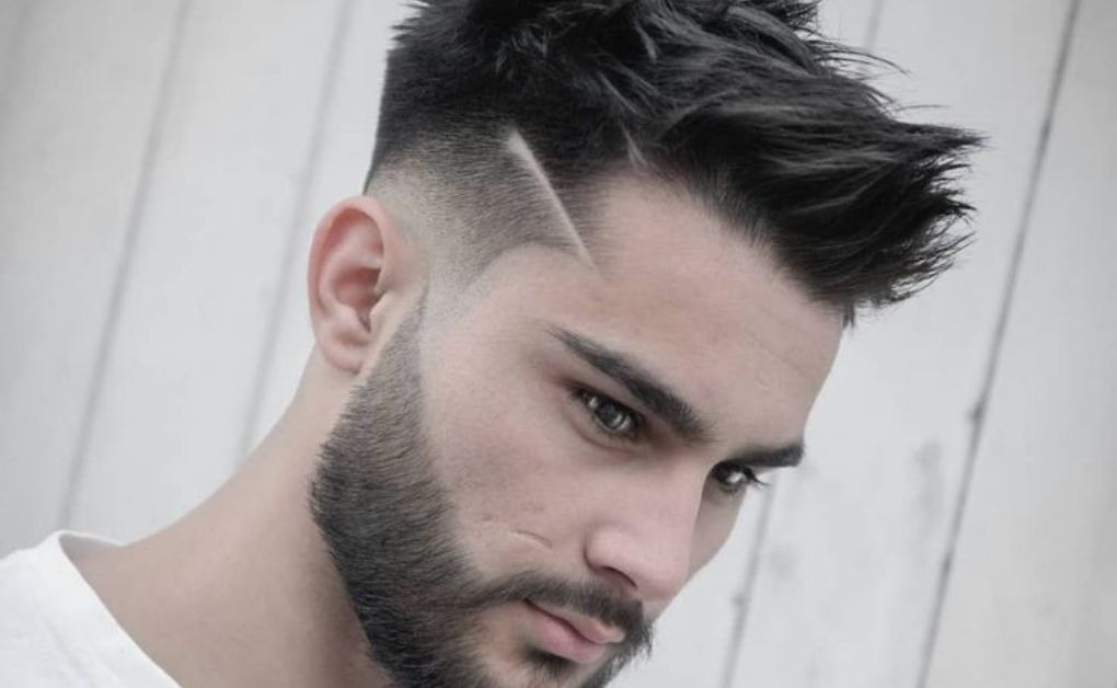 "A trendy Skin-Shaved Finishfeaturing a voluminous modern quiff on top, paired with sharp faded sides for a stylish and energetic aesthetic."